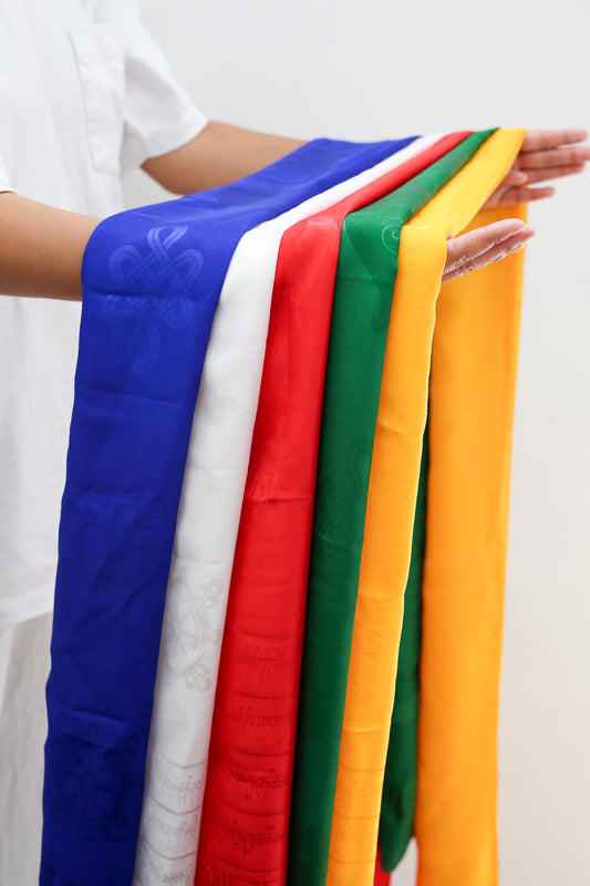 set of five ceremonial khata khada scarves held in hand