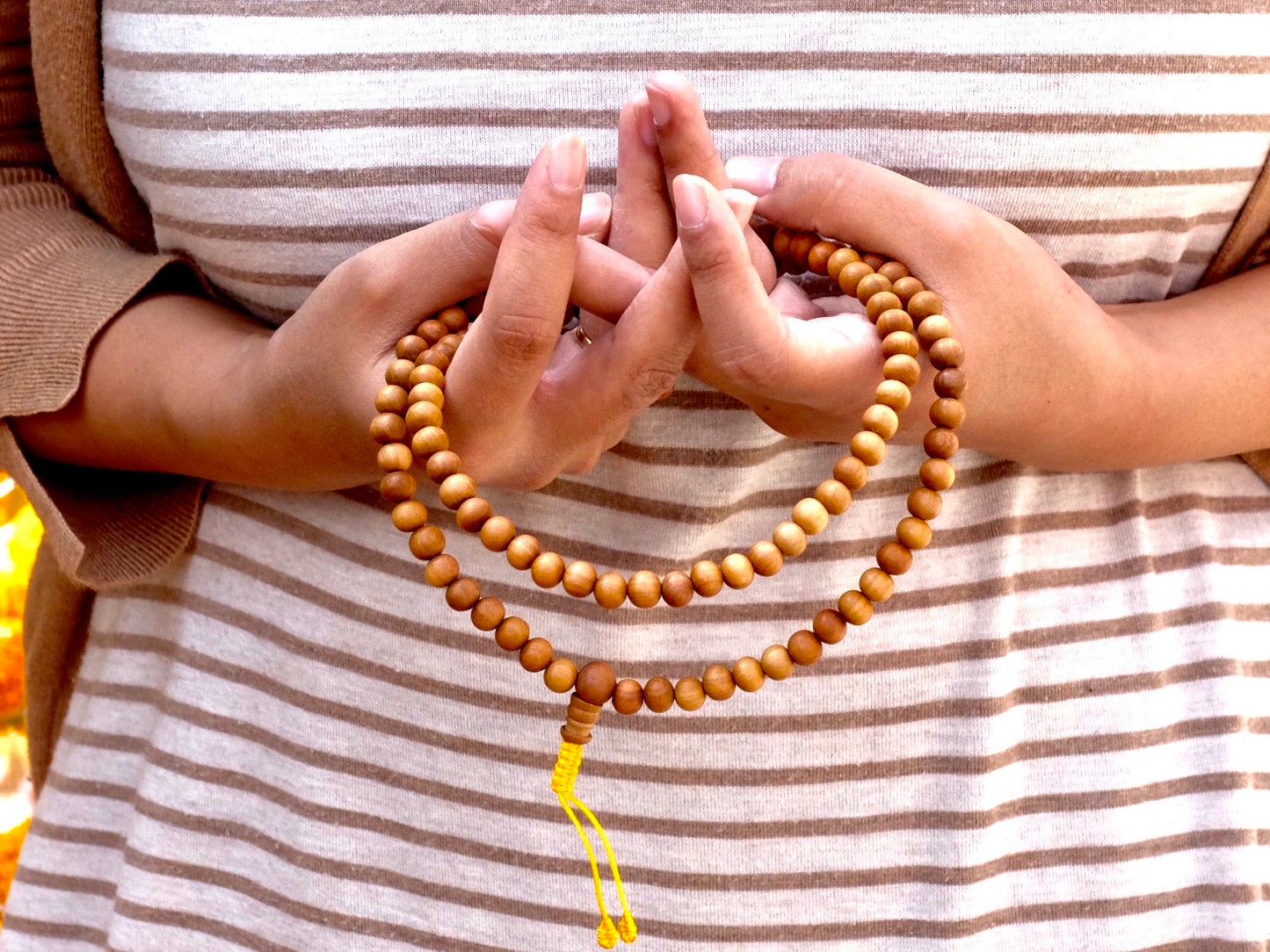 sandalwood mala beads in mandala mudra
