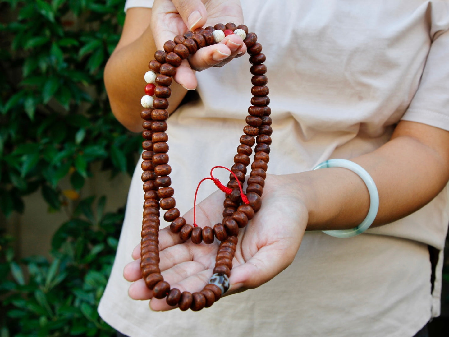 Mala held in hand showing length.