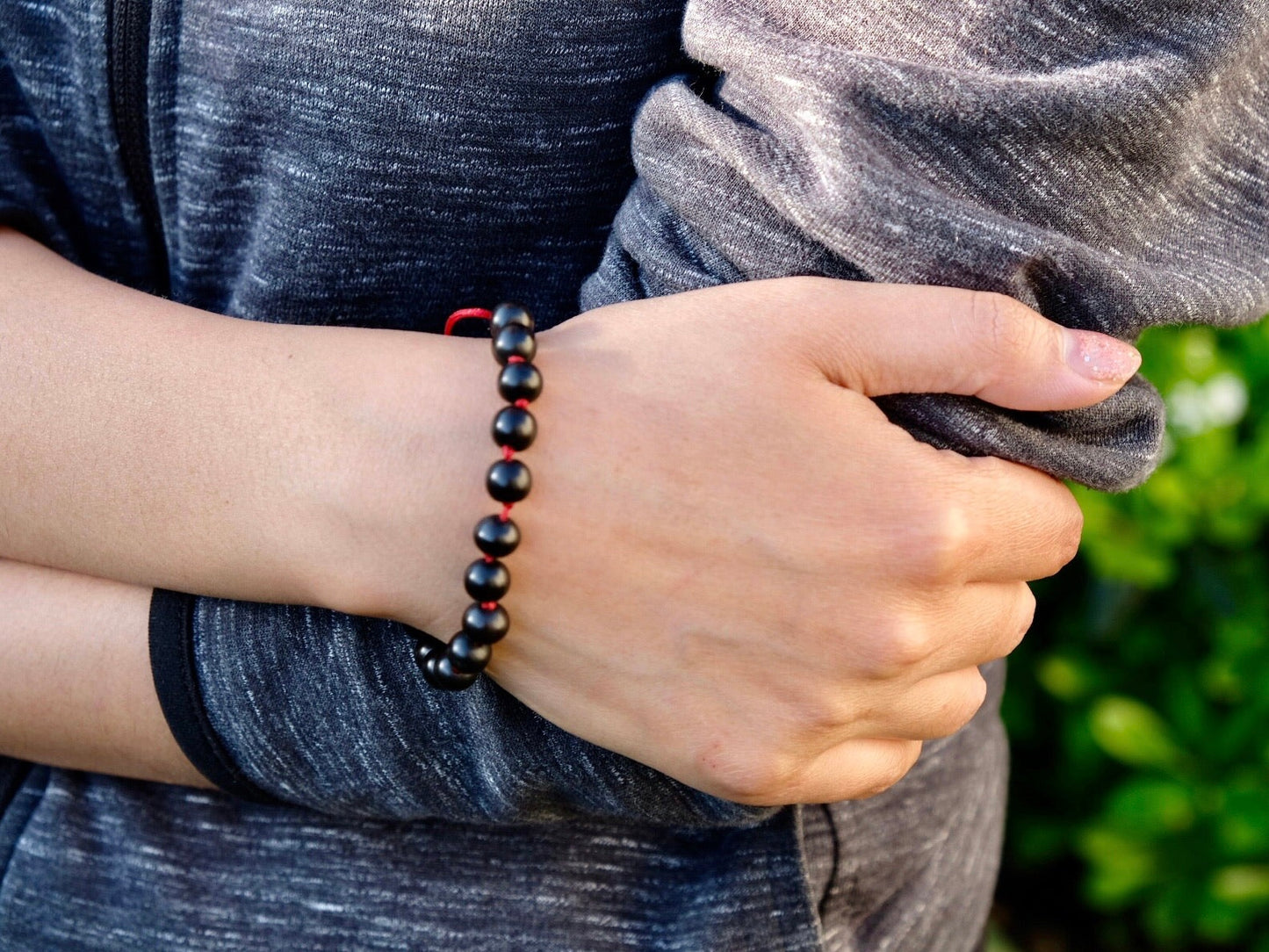 knotted ebony wrist mala on kunga's hand