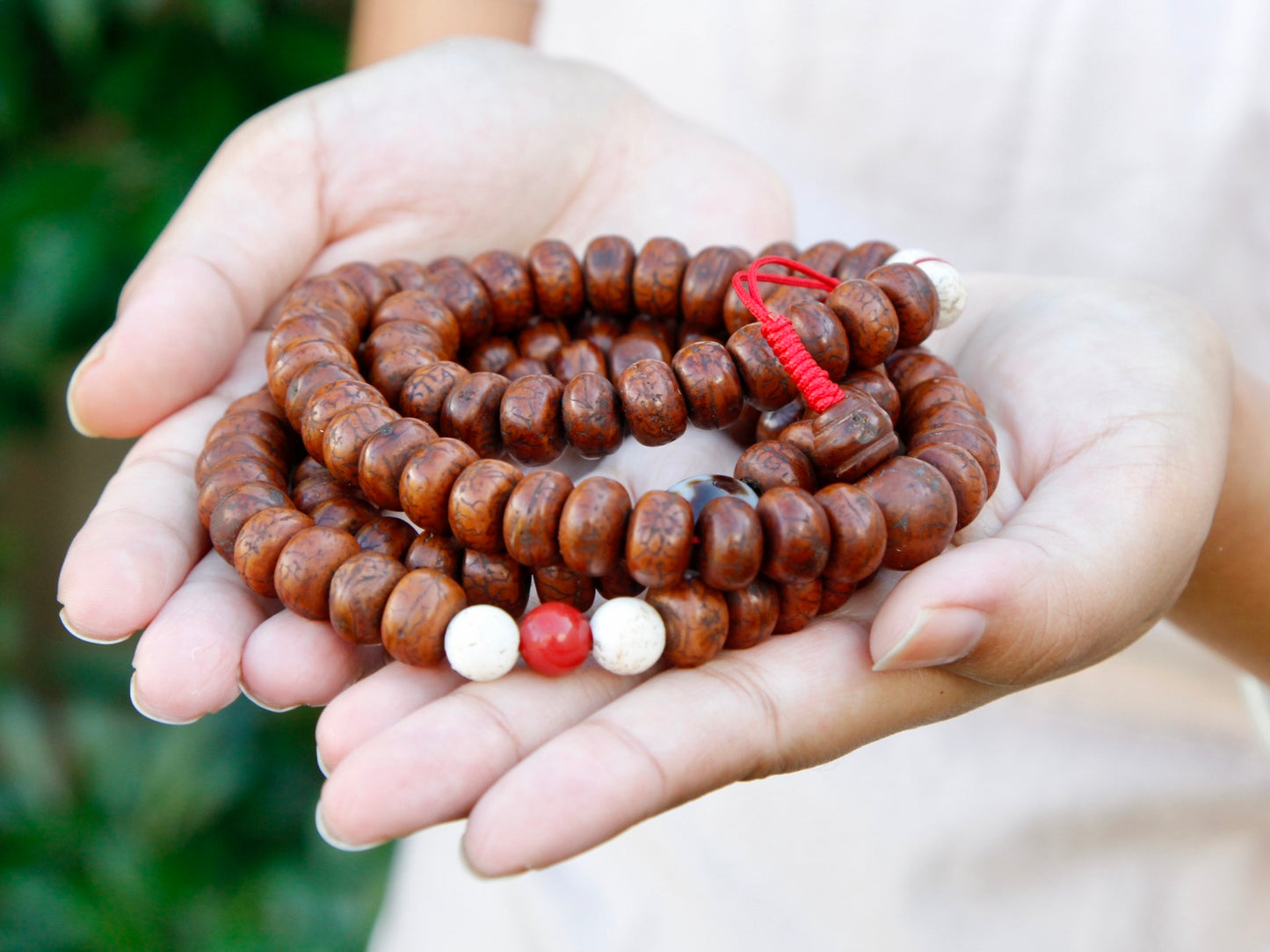 Bodhi seed details when held in hand.