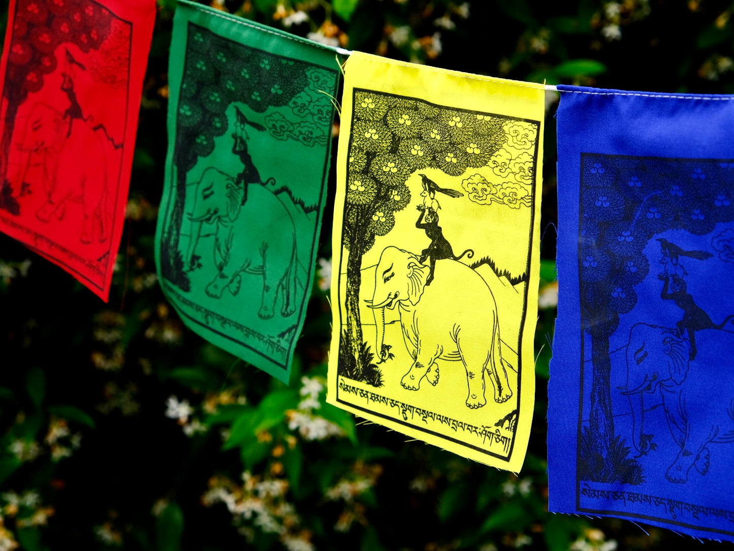 Close up of Four Harmonious Friends Tibetan prayer flags