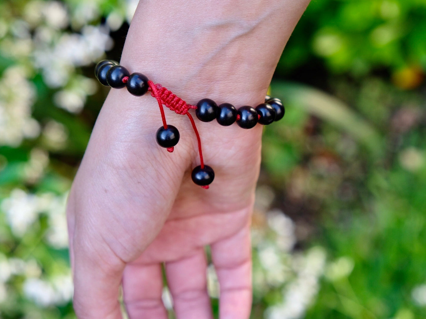 close up of sliding knot of ebony wrist mala bracelet