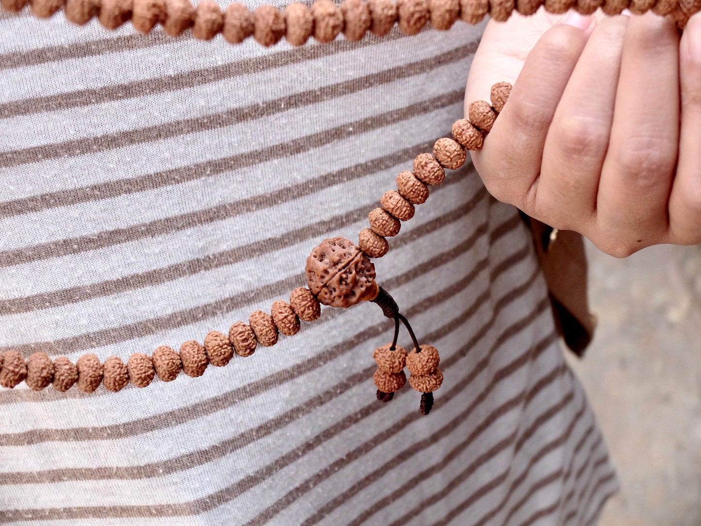 Rudraksha mala close up with Guru bead