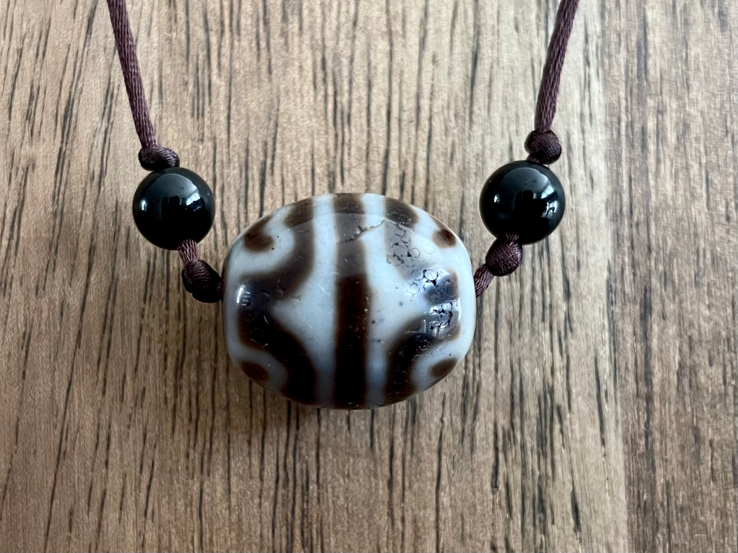 Round Tiger Tooth and Lotus Dzi Bead