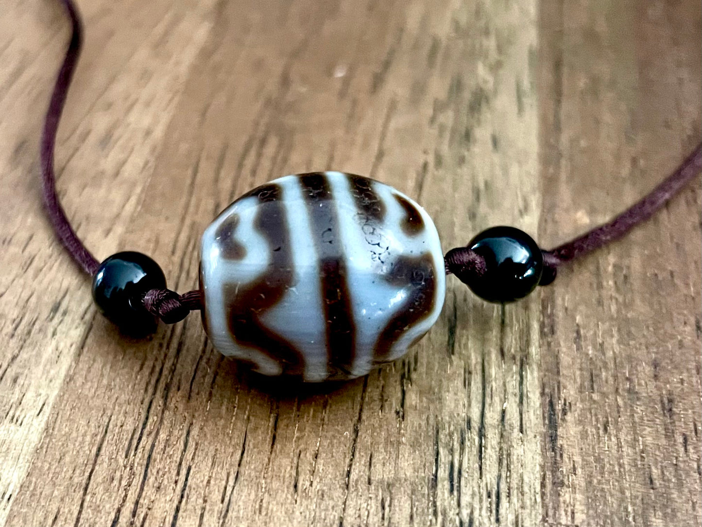 Round Tiger Tooth and Lotus Dzi Bead