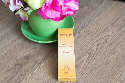 Zambala Tibetan Herbal incense next to flower