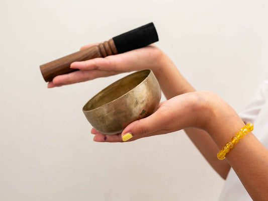 Small singing bowl held in hand