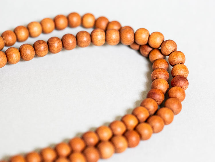 Close up of sandalwood mala beads