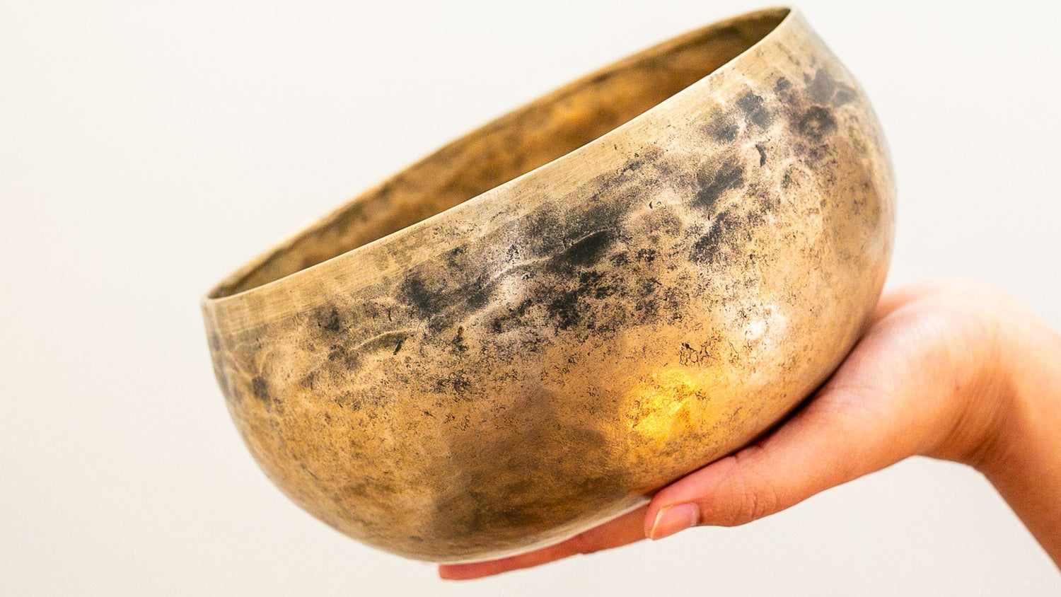 Tibetan singing bowl held in hand 