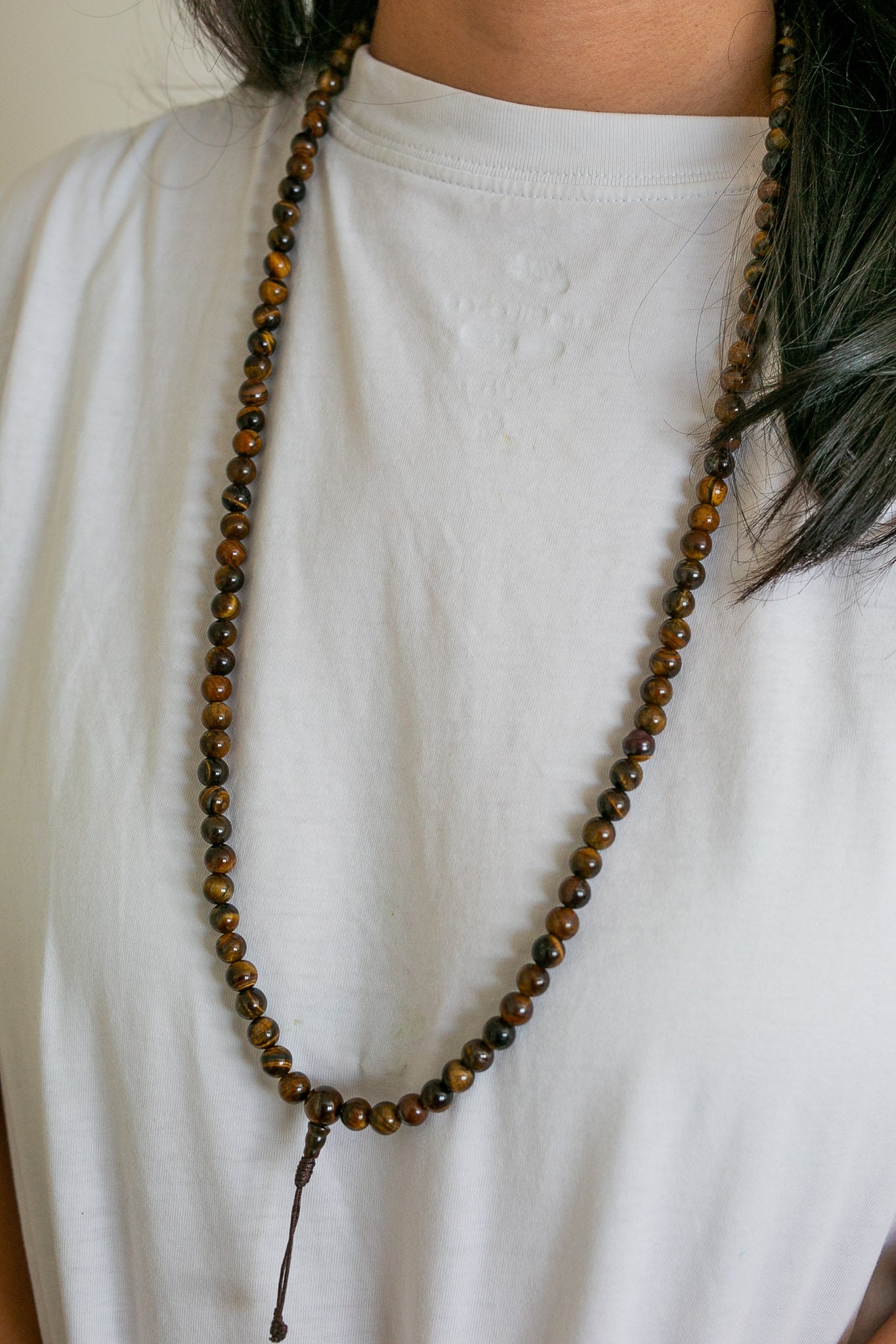 tiger eye mala worn around neck