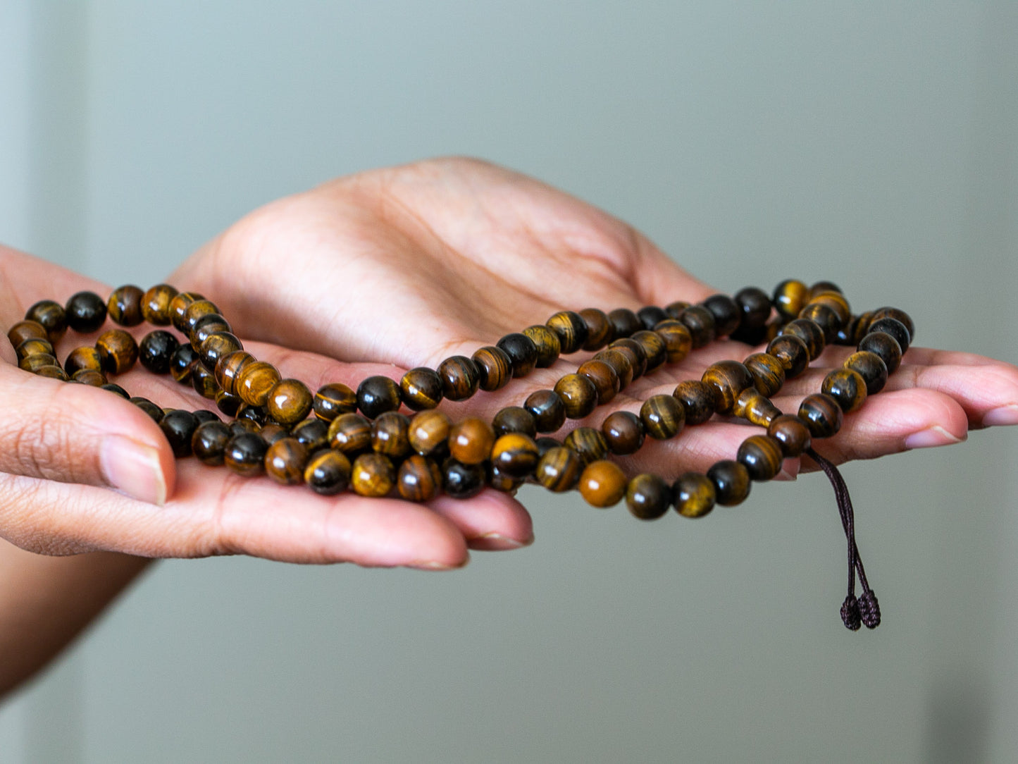 close up of tiger eye mala with 108 beads
