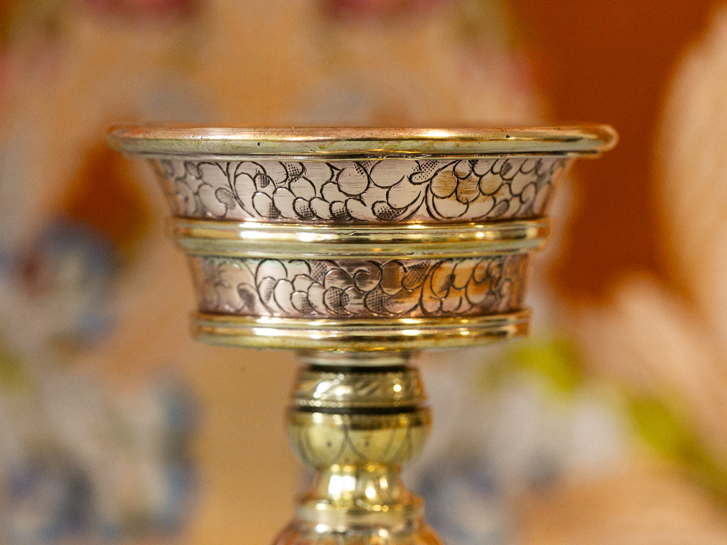 close up of engraving detail in butter lamp