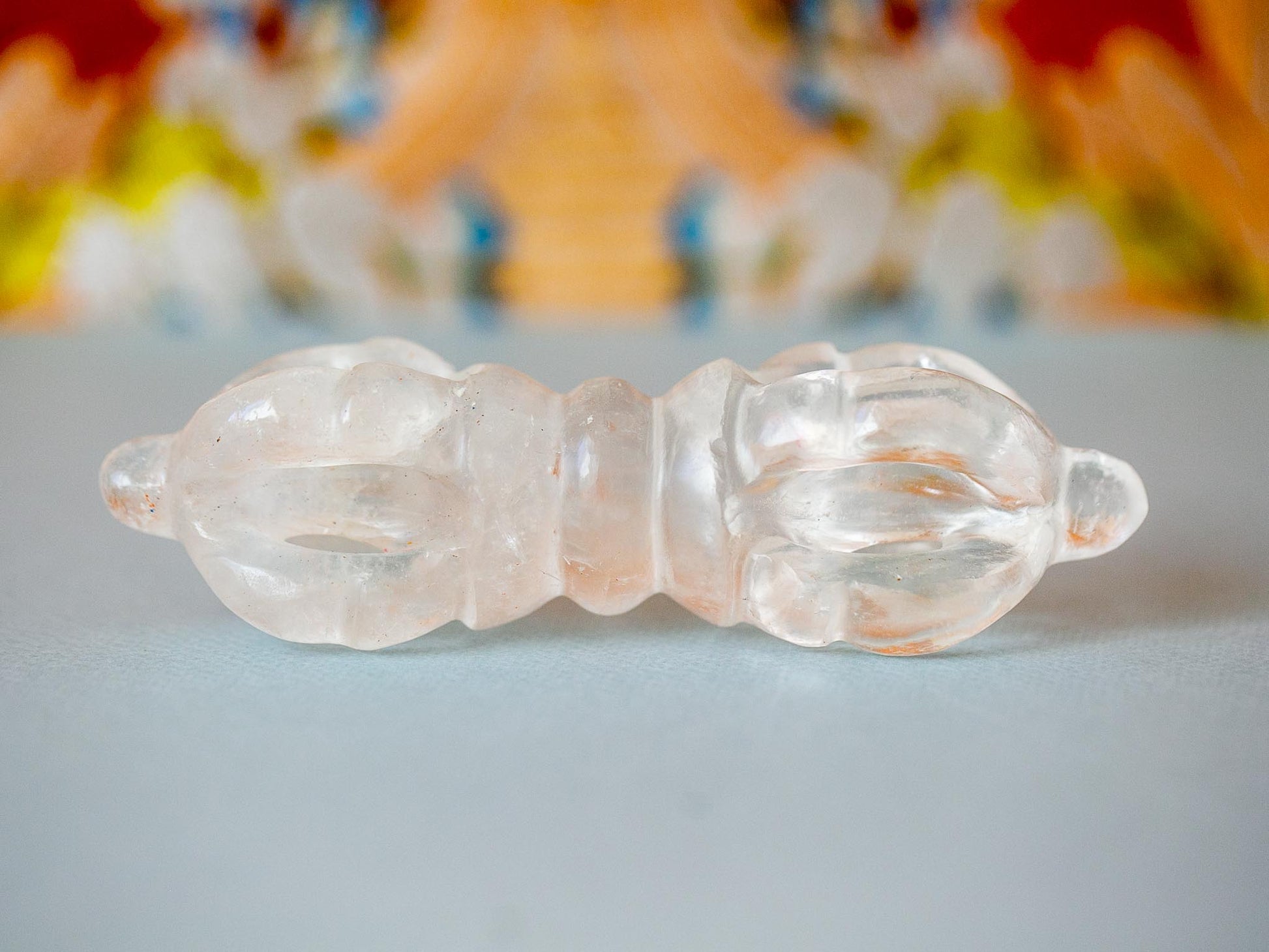 Crystal Vajra against thangka background
