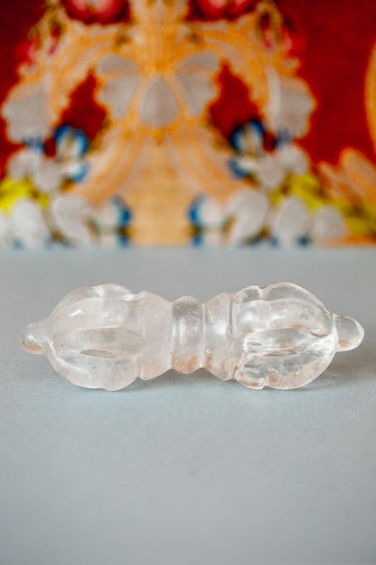 Crystal Vajra against thangka background
