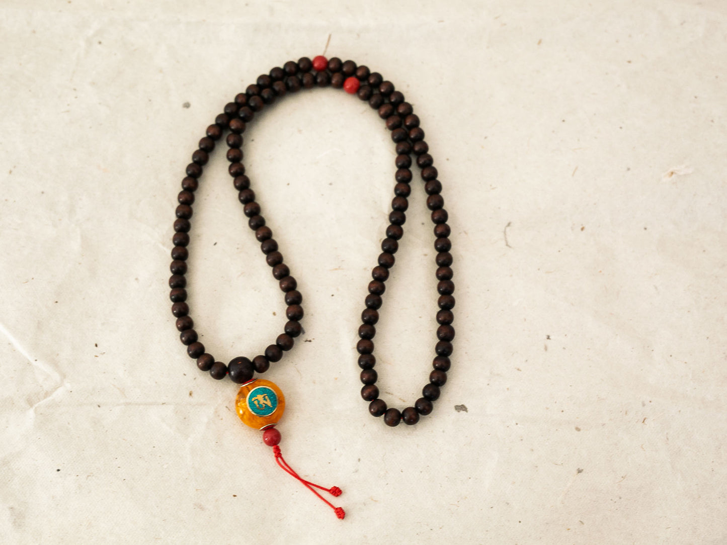 Custom Rosewood Mala with Compassion Eyes Pendant