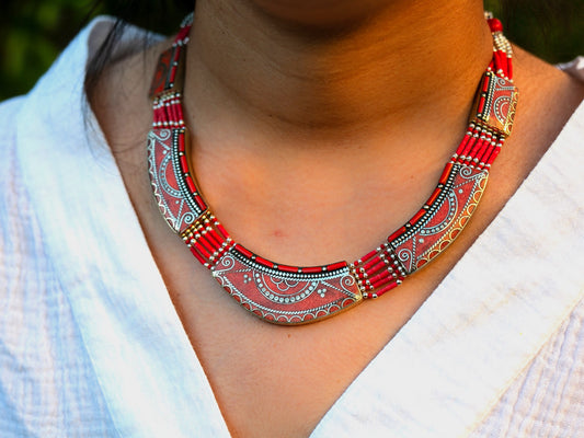 traditional coral necklace wrapped around woman's neck