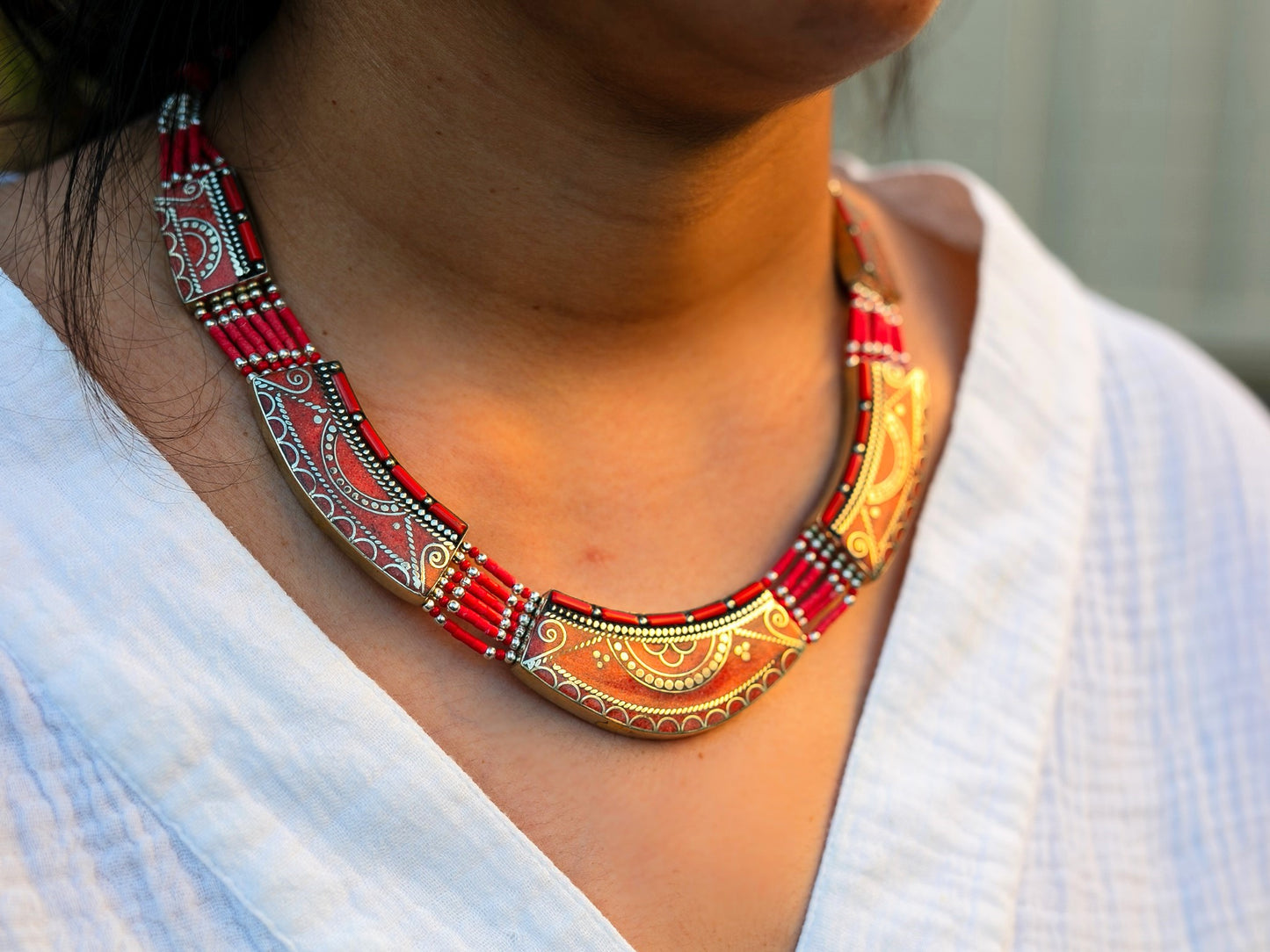 another view of tibetan coral necklace on woman's neck