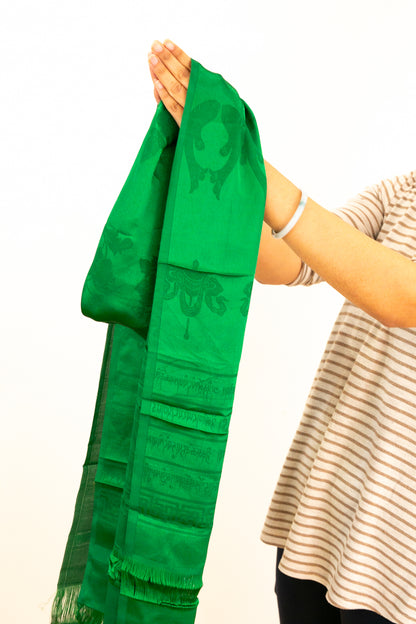 Green khata being held as an offering