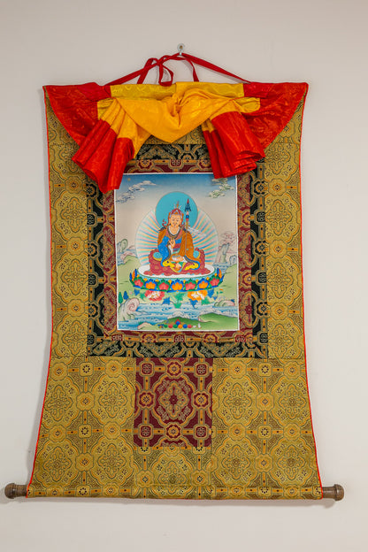 full view of Guru Rinpoche thangka painting on wall