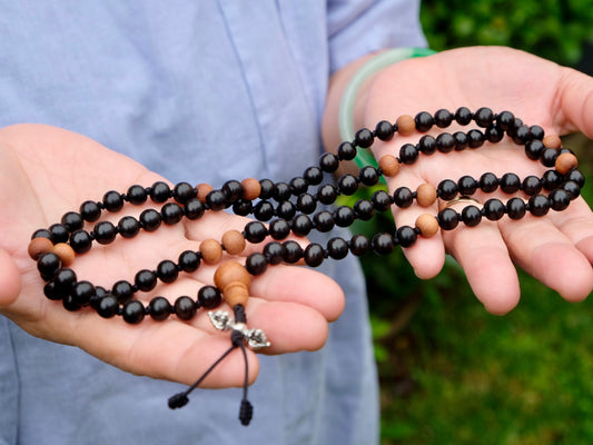 knotted ebony mala with sandalwood beads