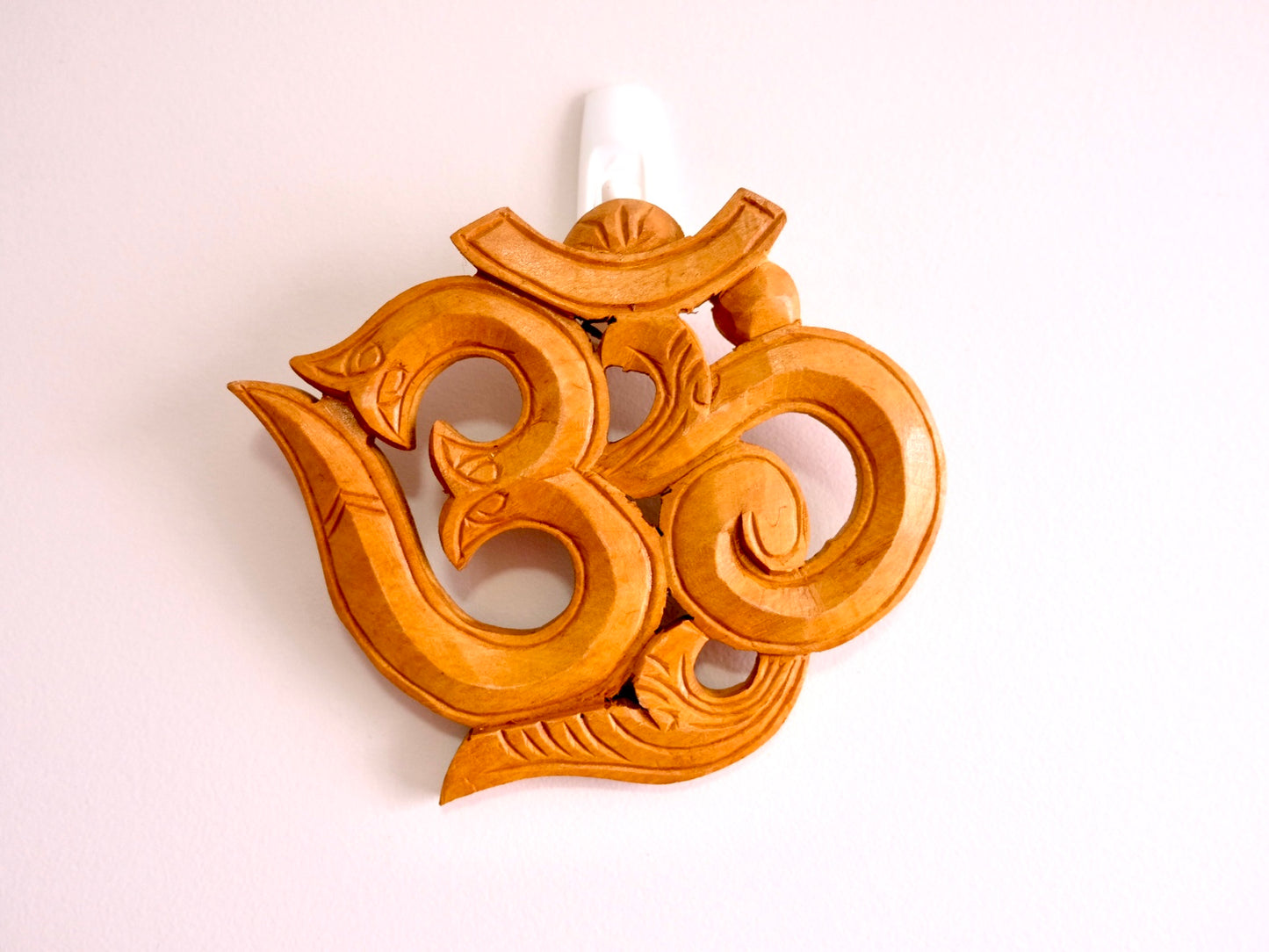 natural finish on decorative om wall hanging