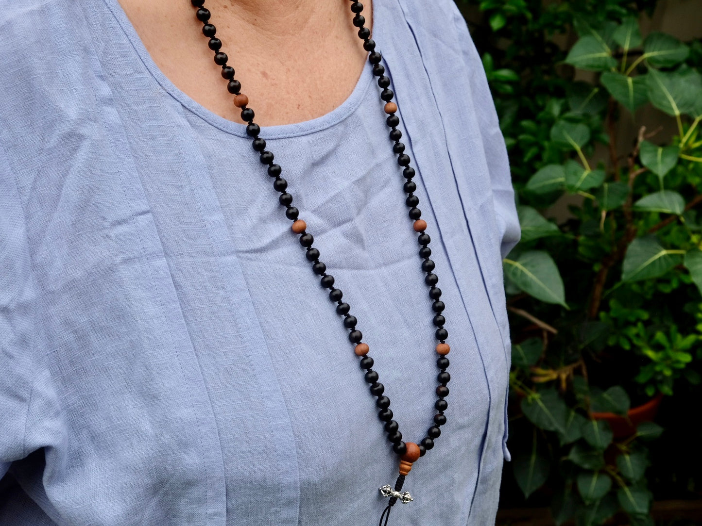 mala worn around amala's neck 