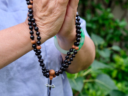 detail of knots and beads in ebony mala