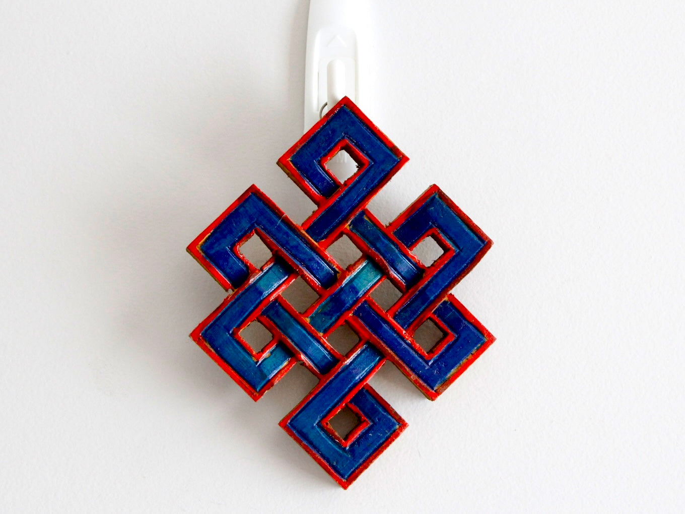 blue variant on wall of infinity knot decorative piece