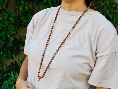 Knotted mala worn around neck to show length