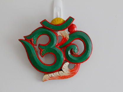 green colour variant of om wall hanging