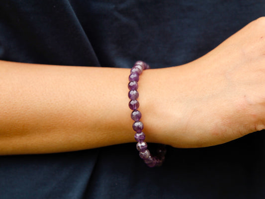 Amethyst Mala bracelet worn on Dhondup's wrist