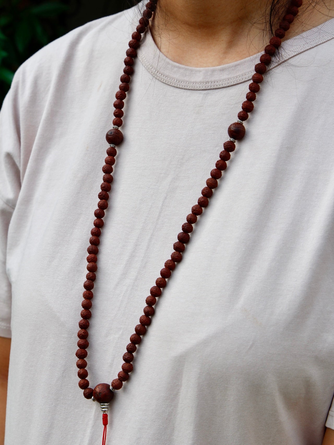 Rakhtu seed mala worn around neck to show length