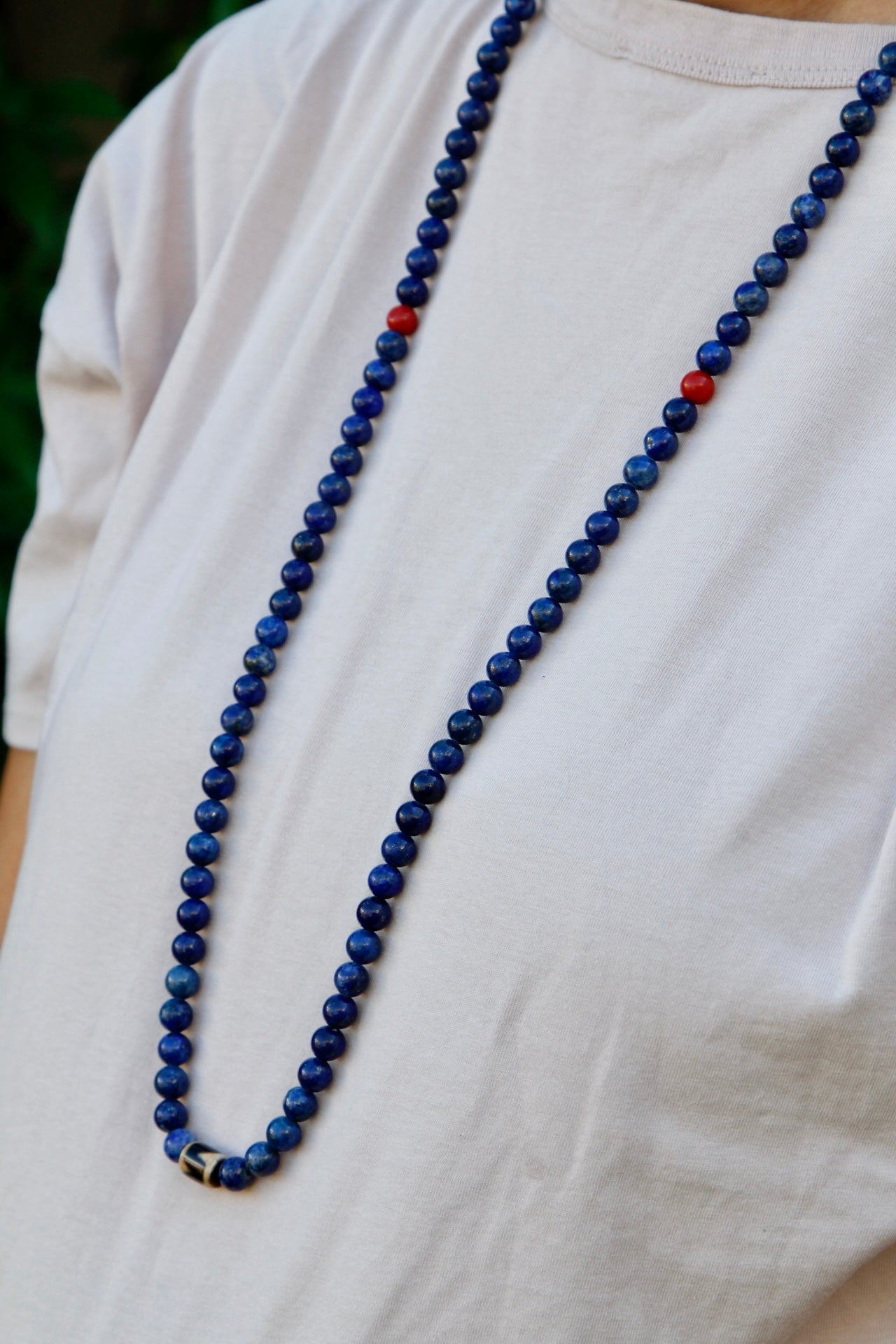 lapis mala worn around neck in portrait mode to show length