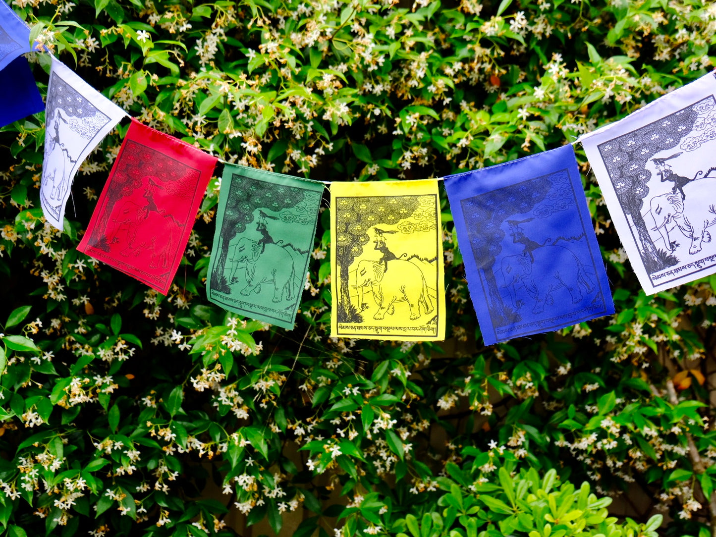 Four harmonious friends prayer flag in garden