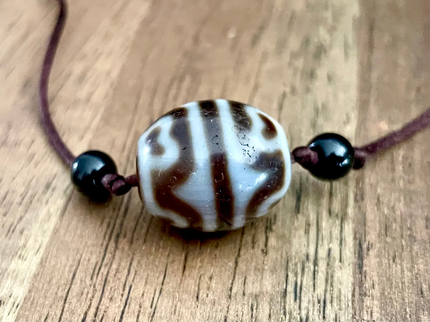 Round Tiger Tooth and Lotus Dzi Bead