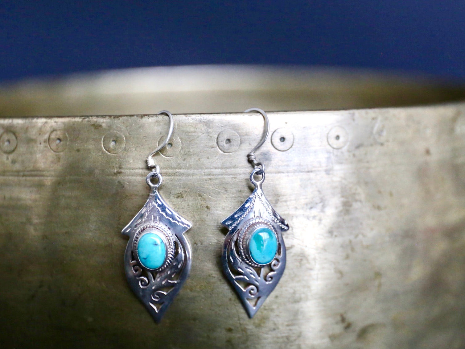 Close up image of Tibetan Turquoise and Silver leaf earring