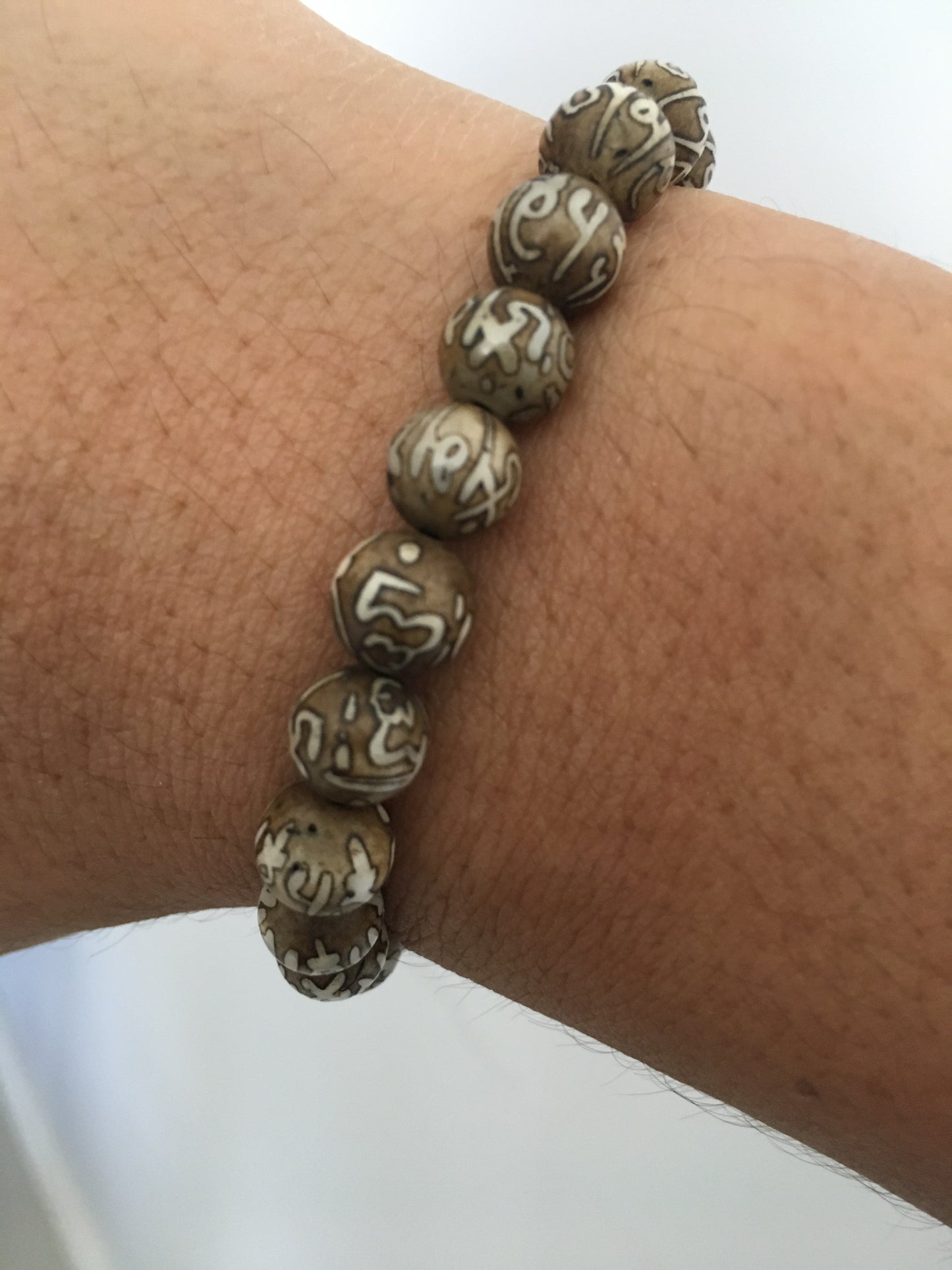 Compassion mantra on conch mala bracelet