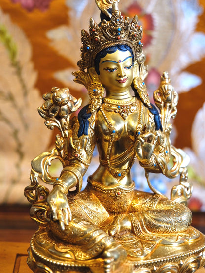 Portrait photo showing details in Tara statue (gold plated)