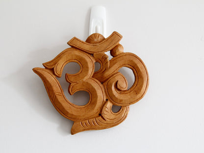 Natural stain variant of Om wooden wall hanging