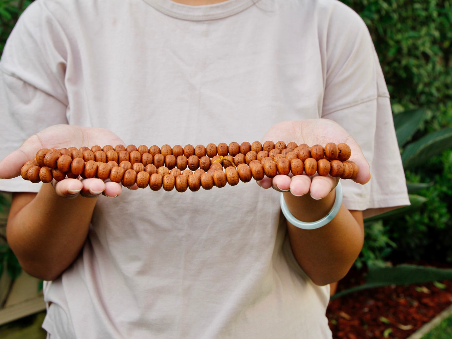 Long Bodhi mala with natural finish in Kunga's Hands