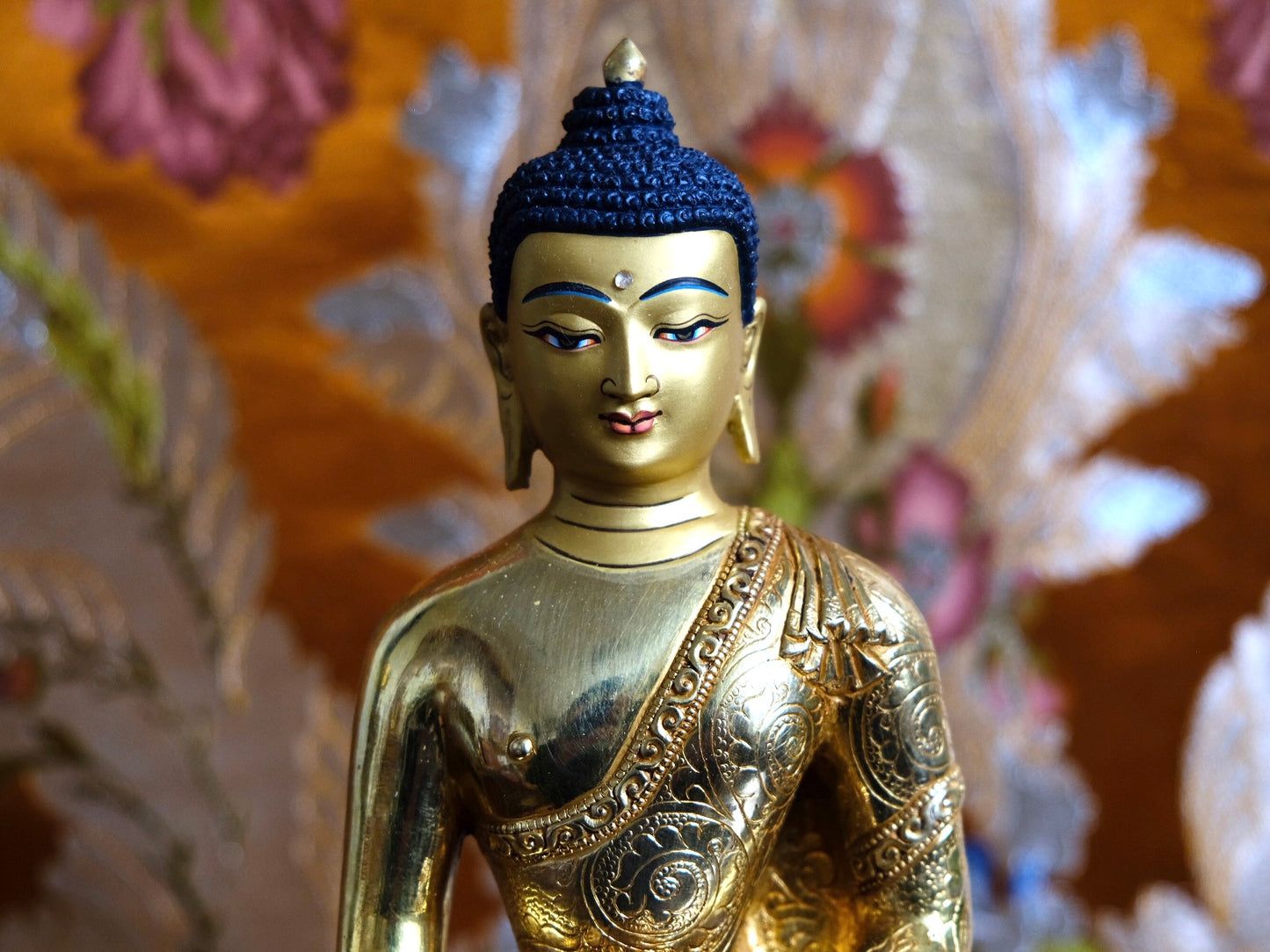 Close up showing calm and peaceful face of Buddha statue