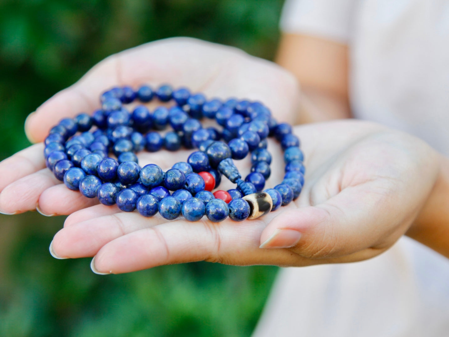 lapis mala rounded up in palm of hands