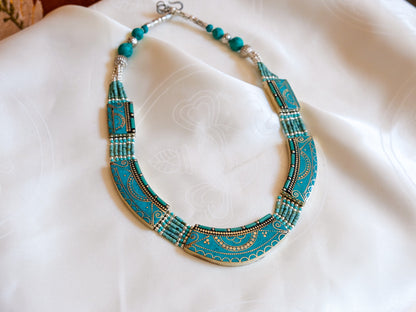 Tibetan turquoise necklace against white background