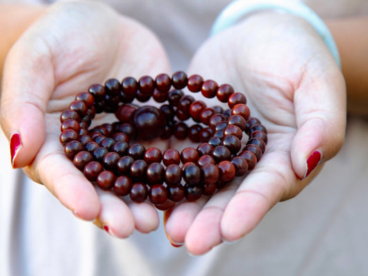 close up of beads in classic rosewood mala