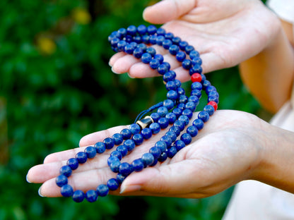 lapis mala showing deep blue colour held in hands